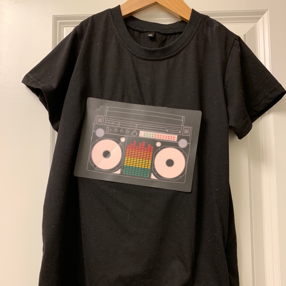 Battery powered t-shirt that lights up with sound